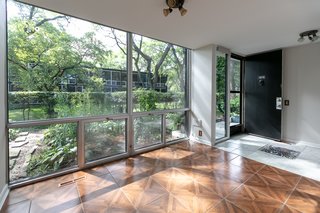 Floor-to-ceiling windows allow for plenty of natural light to enter the home.