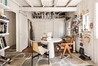 The mixed material palette of stone and wood is present throughout the home. 