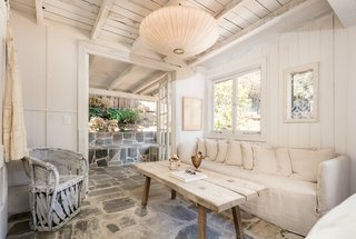 Ford added french doors to the master bedroom, allowing the room to have easy access to the adjacent stone patio. 