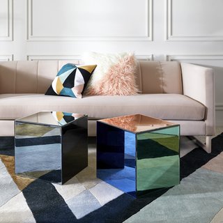 The Vally Sofa in Blush velvet is winner, especially when paired with a few fun throw pillows and mini mirrored Chroma Cube Accent Tables. 