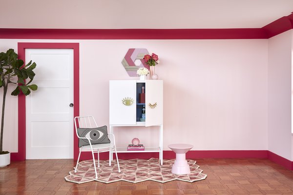The Eye-Con Bar Cabinet is part of the cheeky "Wink of Pink" collection.