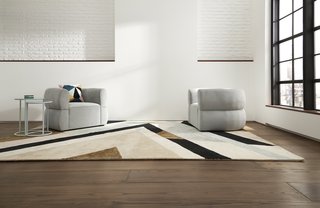 A pair of Cloud Club Chairs in empire ice with a Milan Collection area rug make a chic and graphic modern statement.