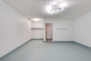 The bomb shelter is accessed via a code-locked door, down a stairwell, and then through an L-shaped corridor. Complete with its own bathroom and air-filtration system, this hidden space could make a perfect private work area. 