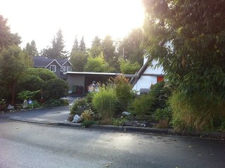 Before: the "wedge-shaped" house had only a flat-roofed carport. 