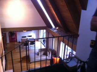 Before: a look down at the living room from the second floor. 