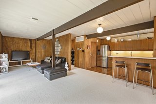 What was previously a small, fifth bedroom was incorporated into the expanded den next to the kitchen, creating a more fluid living space. 