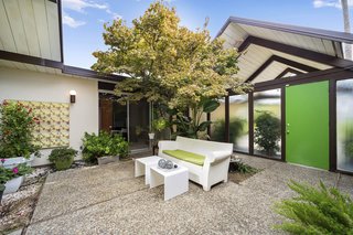 The home's nature-filled center atrium embodies the indoor/outdoor ideal. 