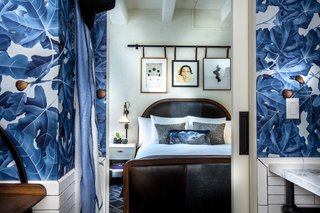 Bright wallpaper custom designed by Studio Collective lines the walls of this guest suite. The fig leaf motif is an homage to the firm's popular pet name for the project: Hotel Fig. It was such a success that the fig design was incorporated into the hotel's branding. 