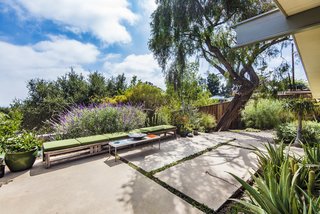 The home is surrounded by gorgeous greenery and peaceful views. 