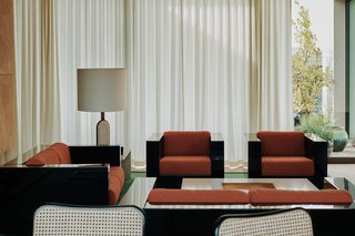 The elegant apartment is furnished with vintage pieces sourced by Speake's company Retrouvius. 