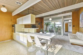 The kitchen cabinetry is also original and contributes to the authentic midcentury vibe. 