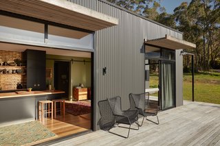 Positioned towards the north, raked ceilings and windows draw natural light into the living area, while eaves and awnings block the harsh summer sun.