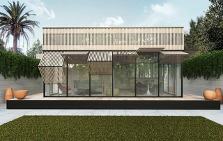This YB1 prefab is outfitted with large windows and light wood paneling. The YB1 grid system allows for homes ranging from 250 to 1,200 square feet.