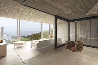 Large windows provide natural light while showcasing the spectacular landscape that surrounds the property. 