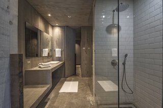 The master suite features a walk-in closet and a beautiful minimalist bathroom.