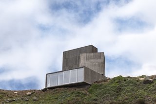 The hillside home is distributed over four levels.