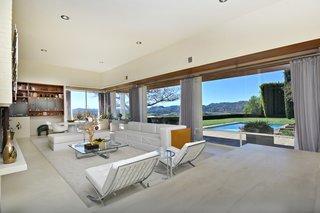 The living room overlooks the swimming pool.