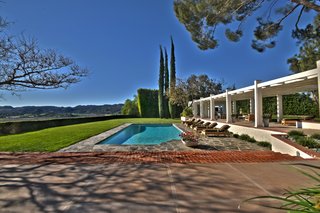 The stunning outdoor poolside terrace leads to a 360-degree view.