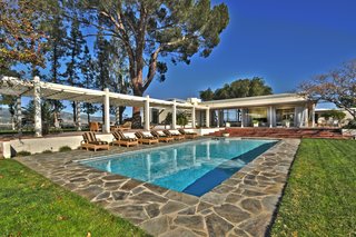 The pool helps the homeowners take advantage of sunny weather. 