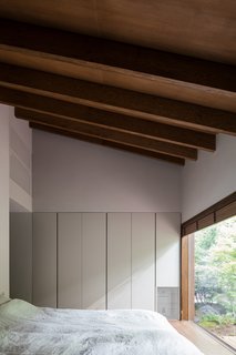 The master bedroom and the master bath enjoy a more private, shaded forest view. 