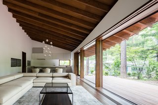 Floor-to-ceiling glazing makes for a bright and airy living space and overlooks the exterior terrace. 