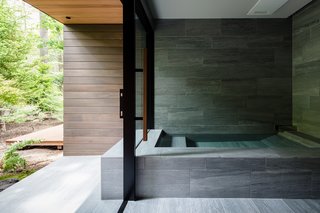 The outline of the bath appears to extend to the exterior of the home. 