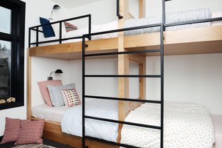 The children's bunk beds are custom made and the bedding is from Schoolhouse. The black Radar Sconces are from Schoolhouse. 
