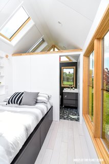 Skylights and large windows keep the interiors bright and airy. 
