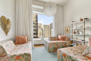 Two additional bedrooms also feature ensuite baths.