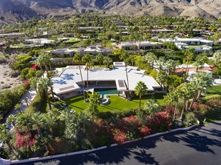 The estate's manicured grounds span over an acre.