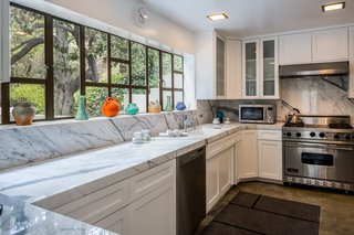 The updated kitchen features high-end appliances.