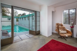 A sitting room is located just off the pool. 