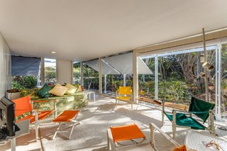 The house’s wood shutters allow residents to control how much privacy and light they want, while protecting the building from wind and rain.