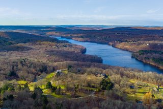 The luxurious country estate has breathtaking panoramic views of the Croton Reservoir and beyond. 