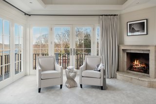 A view of the sitting area with french doors leading out to the balcony. 