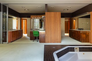 The master bath has "his and her" dressing rooms and a spa bath. 