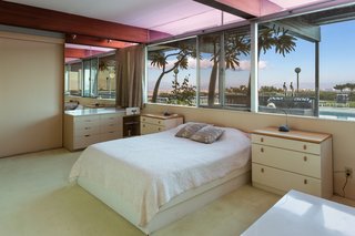 The second bedroom has views of the pool. 