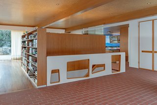 Breuer’s signature floating staircase features abstract geometric cutouts.