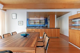 The open kitchen overlooks the dining area. 