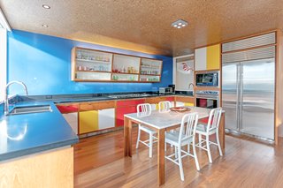 The kitchen offers modern conveniences but maintains a cool Bauhaus feel. 