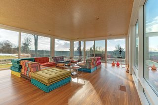 A second living room features expansive views of the beautiful surroundings.