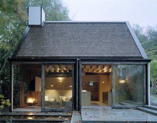 Full-height sliding glass doors bring a sense of the outdoors into the home. 