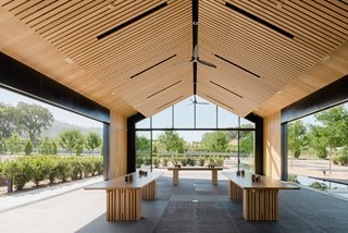 The indoor/outdoor structure embraces the wine-making process and provides a strong sense of space. The exterior wood is repurposed 100-year-old wine tanks.