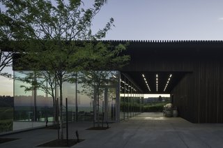 Waechter Architecture expanded and re-clad the existing winery with a vertical 2" x 2" blackened cedar screen. During the day, the body of the building takes on a solid appearance. At night, the screen takes on an ethereal, translucent character as interior illumination backlights the vertical cedar ribs. 
