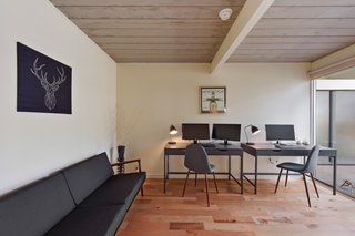 With five bedrooms, the home offers space enough to host an office.
