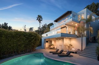 The villa features two large terraces which overlook the swimming pool and provide panoramic city views.