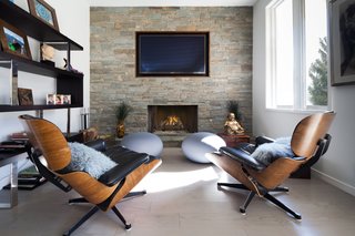 A brick-inlay fireplace creates a cozy, light-filled nook. 