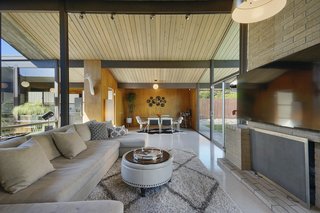 The dining nook sits between the kitchen and the living room. 
