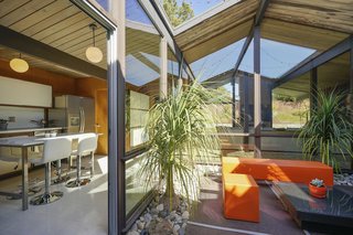 The atrium and adjacent skylights provide bright and airy interiors throughout. 