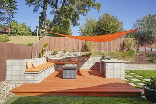 The deck features a dining area with concrete countertops, solar shade, and power. Set just off the great room, it can serve as an extension of the home for true indoor/outdoor living.